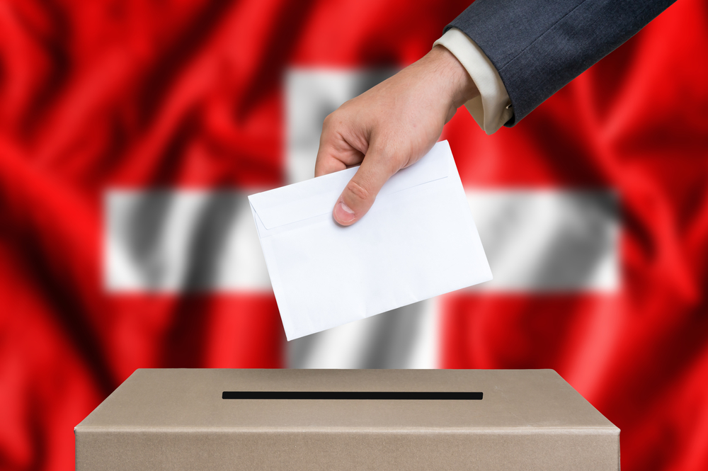 Election,In,Switzerland.,The,Hand,Of,Man,Putting,His,Vote