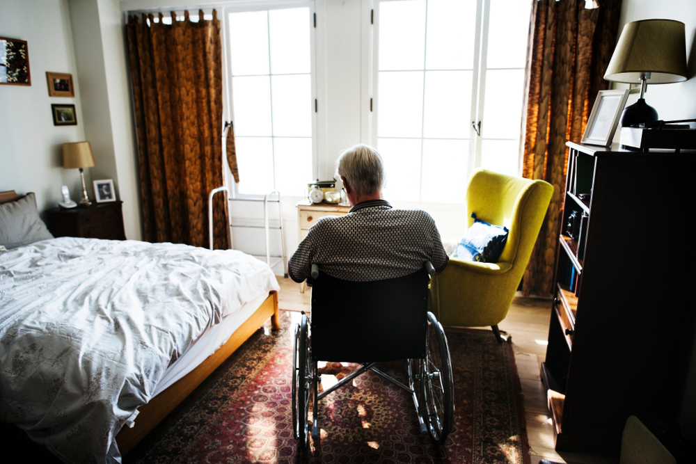 Senior,Man,Sitting,On,The,Wheelchair,Alone