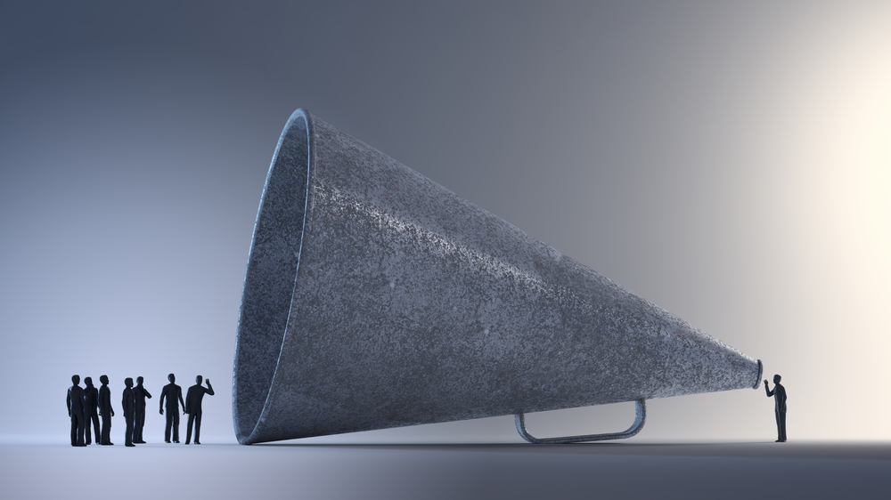 Tiny,People,Communicating,Through,A,Vintage,Megaphone