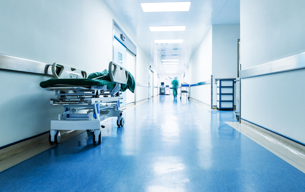 Doctors,Or,Nurses,Walking,In,Hospital,Hallway,,Blurred,Motion.