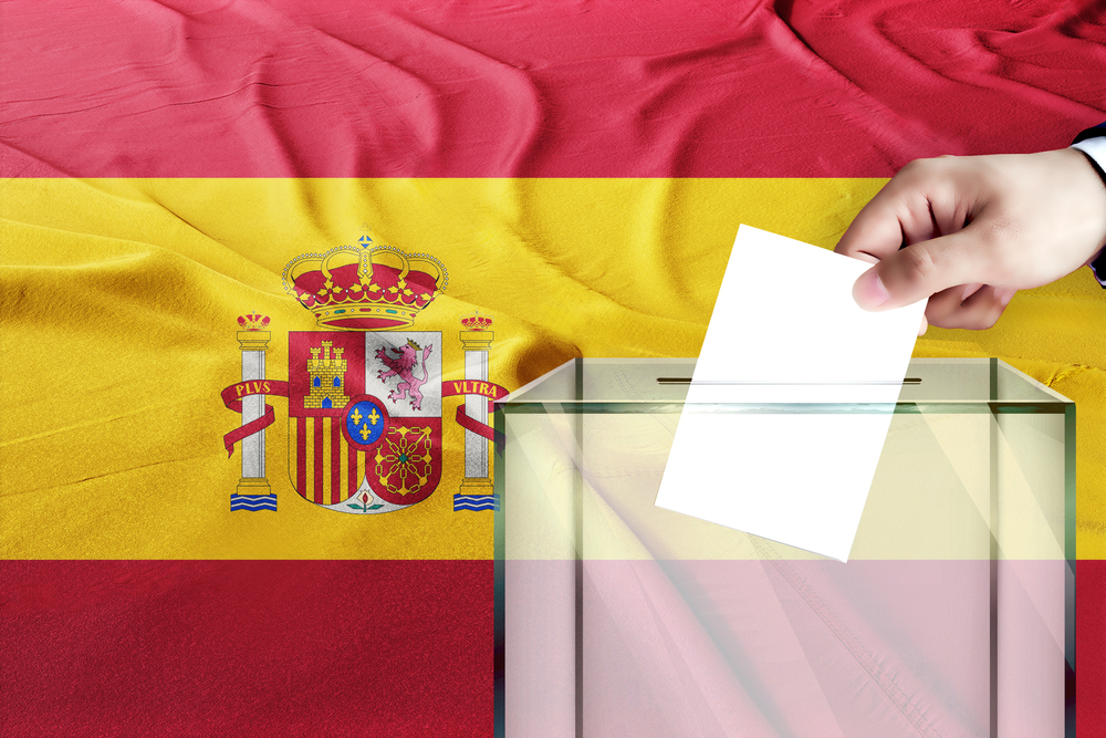 Spain,Flag,,Spain,The,Symbol,Of,Elections,Male,Hand,Puts