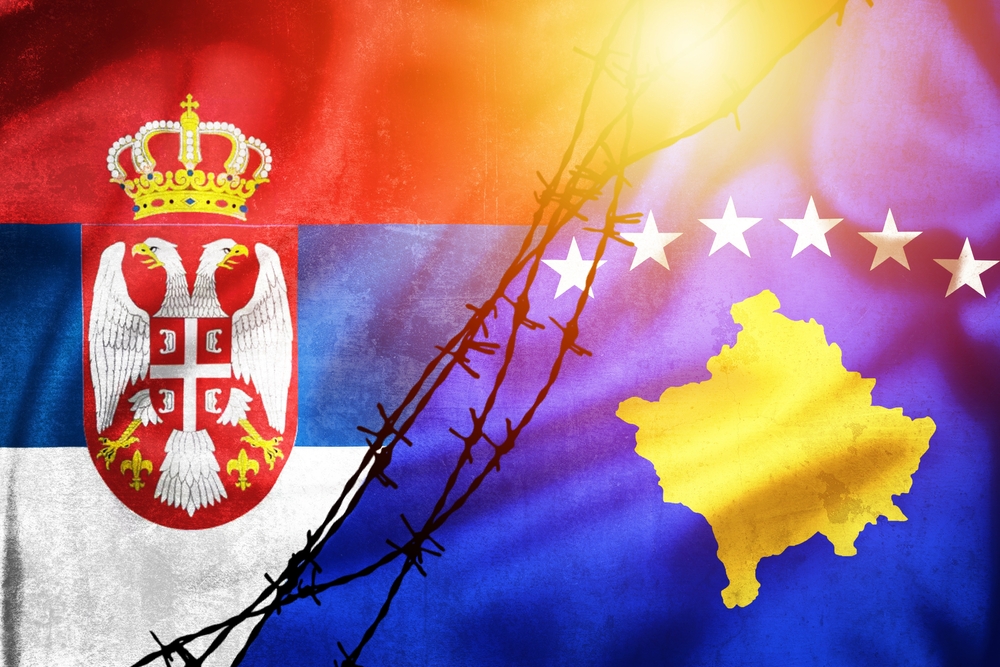 Grunge,Flags,Of,Serbia,And,Kosovo,Divided,By,Barb,Wire