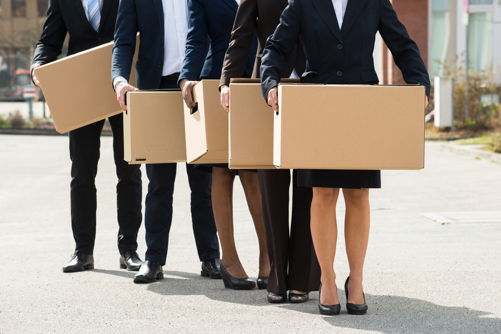 Close-up,Of,Businesspeople,With,Cardboard,Boxes,Standing,In,A,Line;outdoor