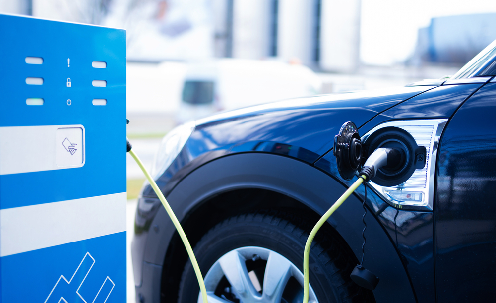 An,Electric,Car,Is,Being,Charged,At,A,Charging,Station