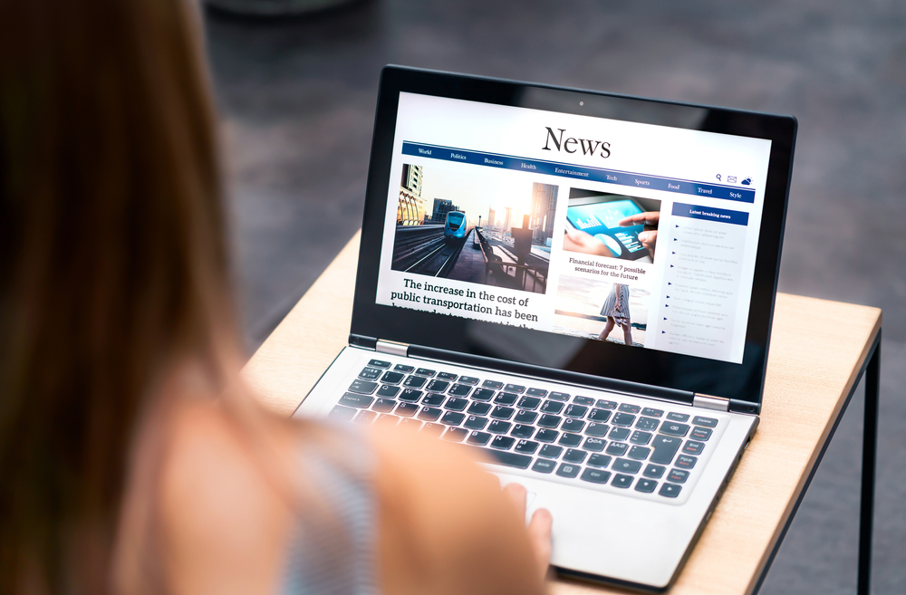 News,Website,In,Laptop,Screen,With,Online,Article,And,Headline.