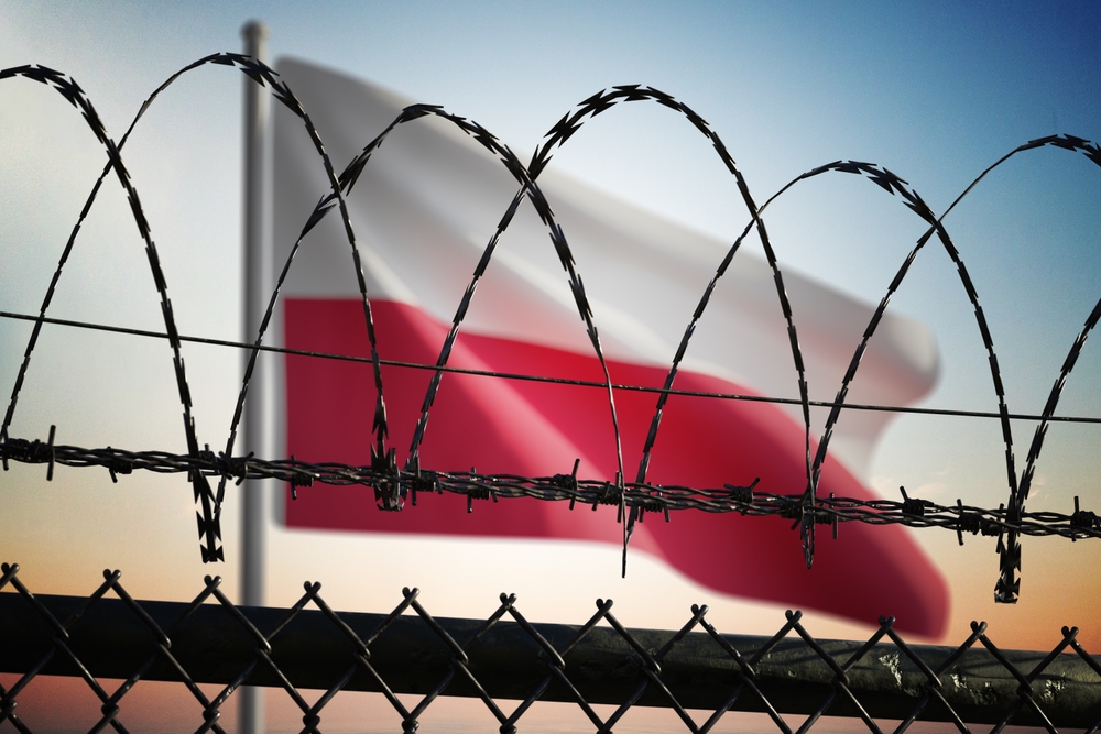 Polish,Flag,Behind,Barbed,Wire,Fence.,Illegal,Immigration,And,Security