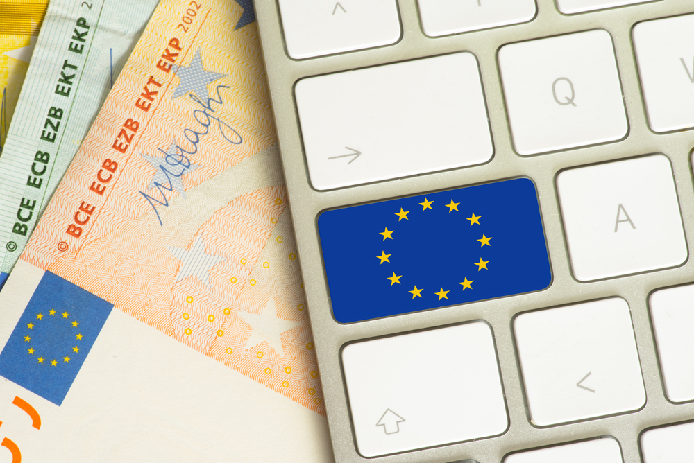 Computer,,Flag,Of,The,European,Union,And,Many,Euro,Banknotes