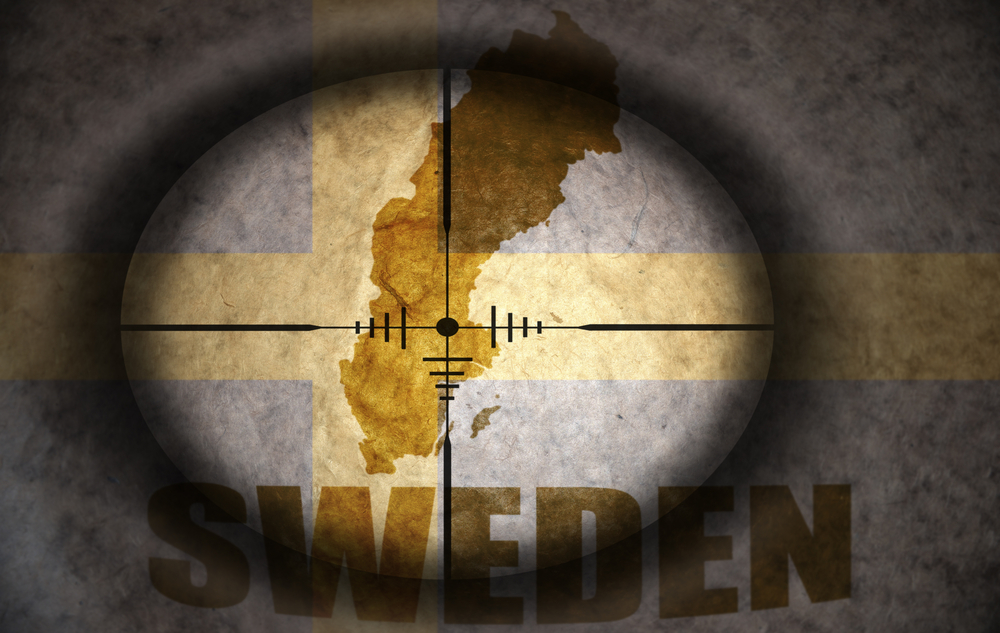 Sniper,Scope,Aimed,At,The,Vintage,Swedish,Flag,And,Map