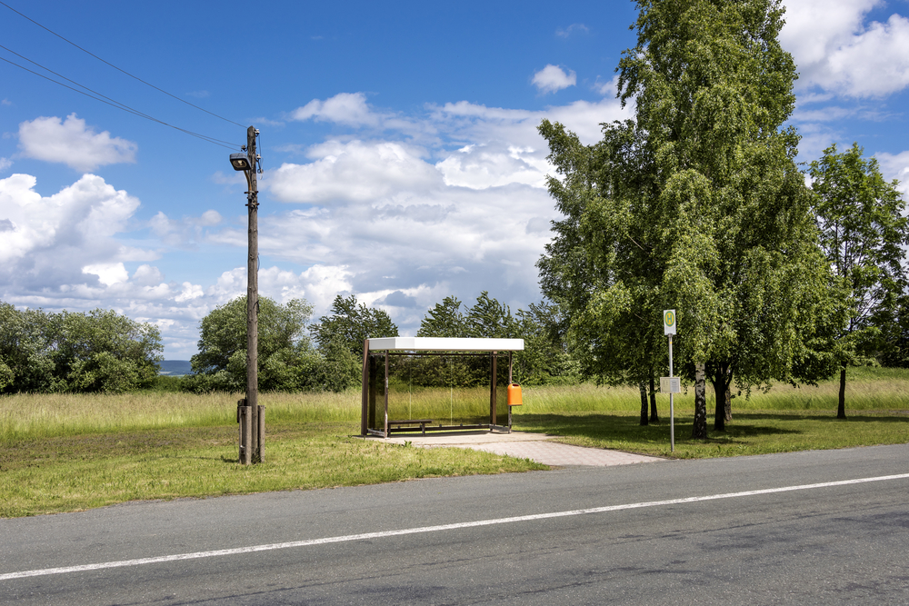 Germany,,Thuringia,,Bucha:,Street,Scene,With,Lonely,Bus,Stop,,Tarred