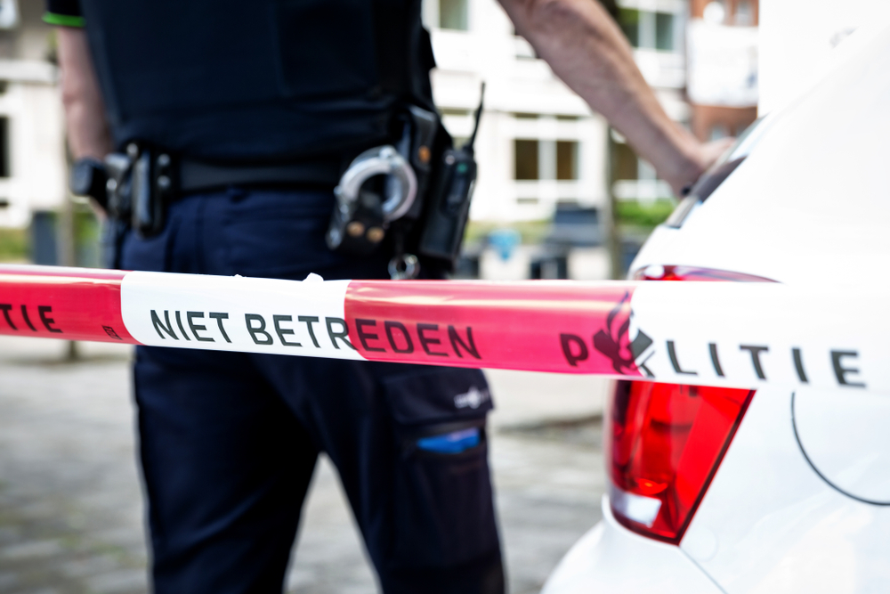 Dutch,Policeman,On,Crime,Scene,At,School.,Red,Tape,With