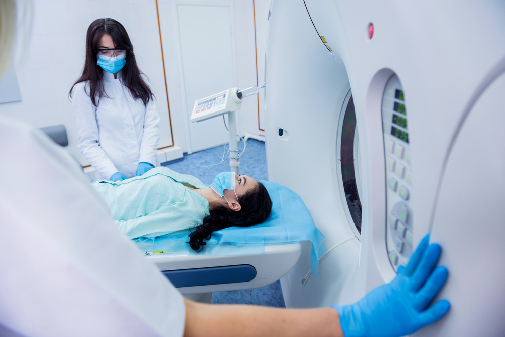 Radiologist,With,A,Female,Patient,In,The,Room,Of,Computed
