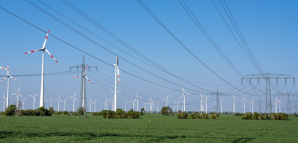 Wind,Trubines,And,Electric,Power,Lines,Seen,In,Germany