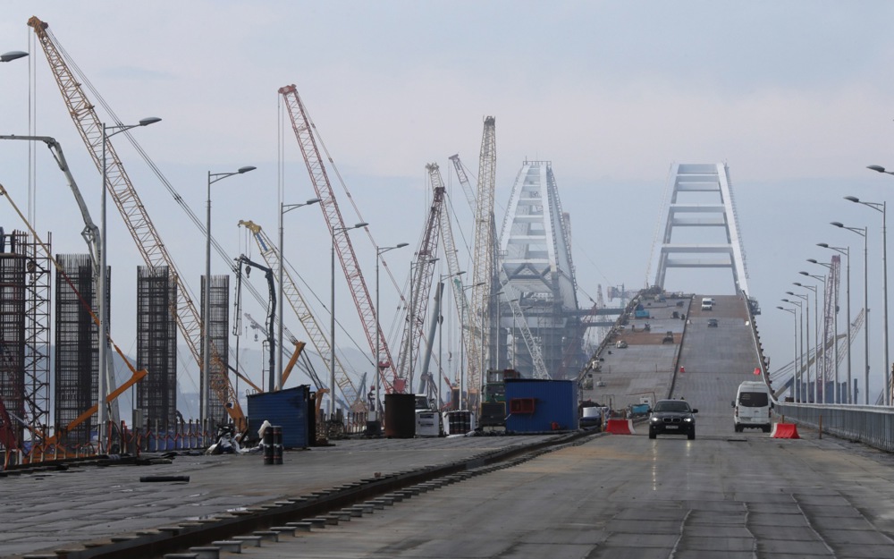 Russian President Vladimir Putin visits the construction site of the Crimean Bridge
