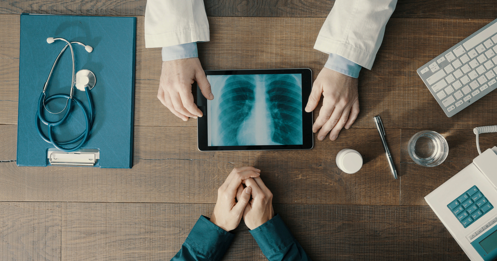 Doctor,Meeting,A,Patient,In,The,Office,And,Giving,A