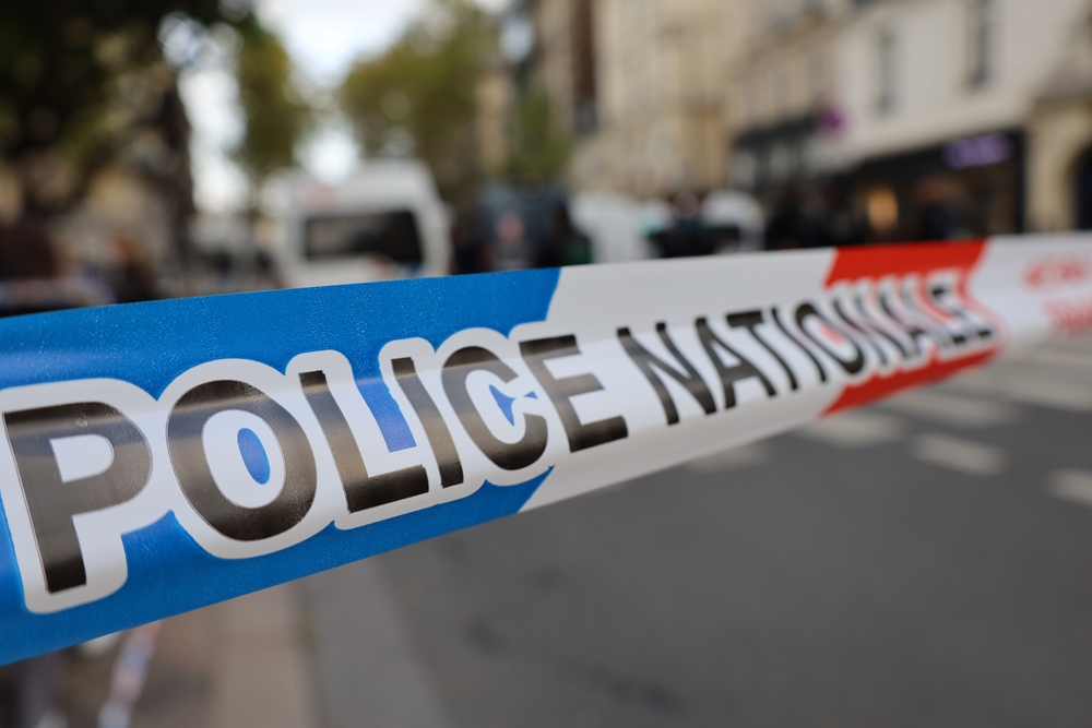 Real,French,Police,Tape,Ribbon,With,Blurry,Street,Crime,Scene