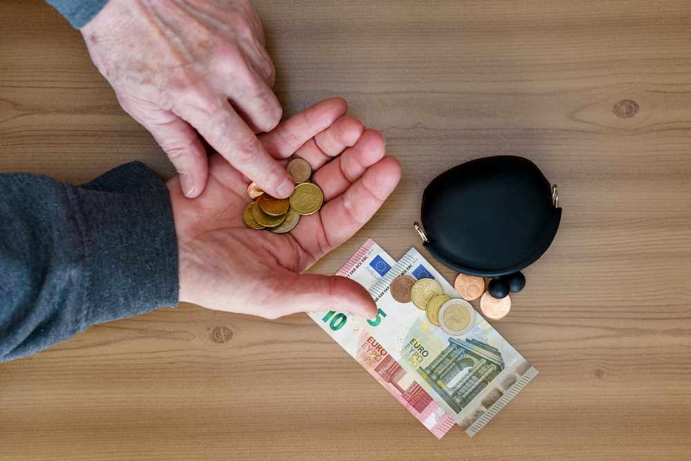 Hands,Counting,Small,Coins.,There,Is,A,Wallet,And,A