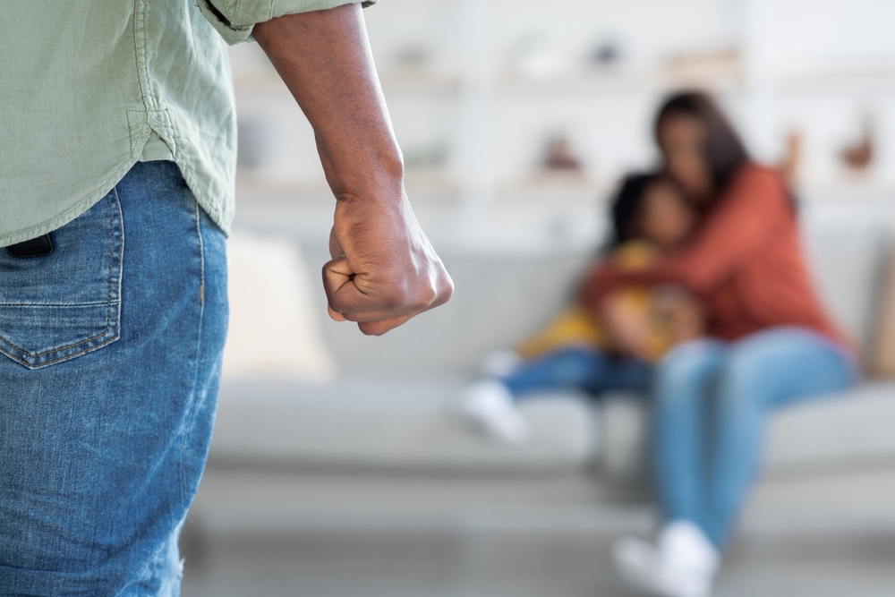 Domestic,Violence.,Unrecognizable,African,American,Man,Threatening,Wife,And,Daughter