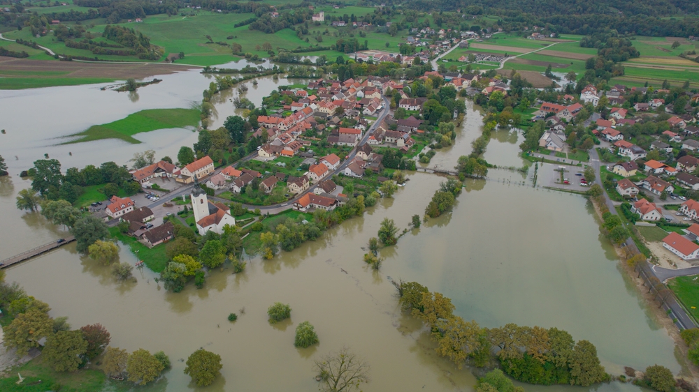 Aerial:,Autumn,Flooding,Around,Rural,Village,With,Large,Areas,Of