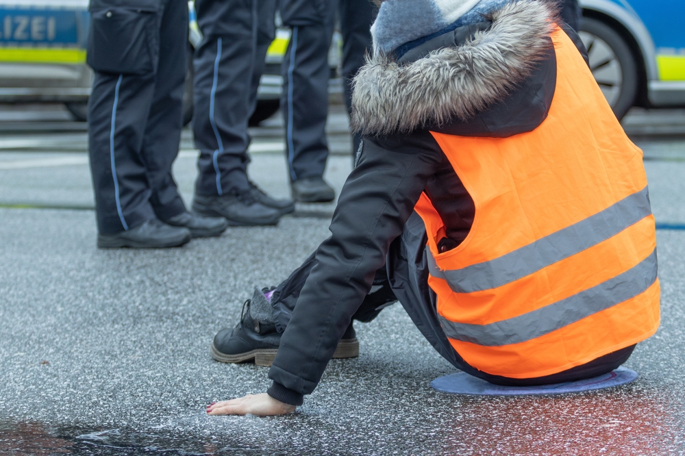 A,Climate,Activist,Stuck,Herself,To,The,Asphalt,In,Hamburg