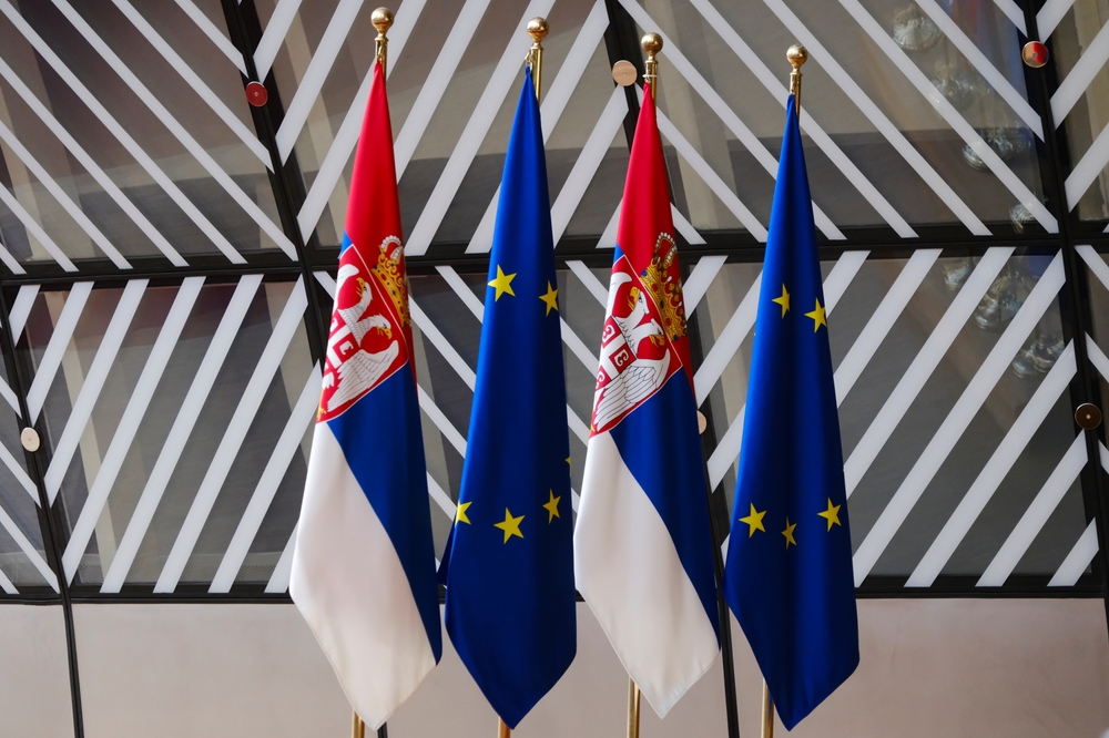 European,And,Serbian,Flags,At,Eu,Headquarters,In,Brussels,,Belgium,