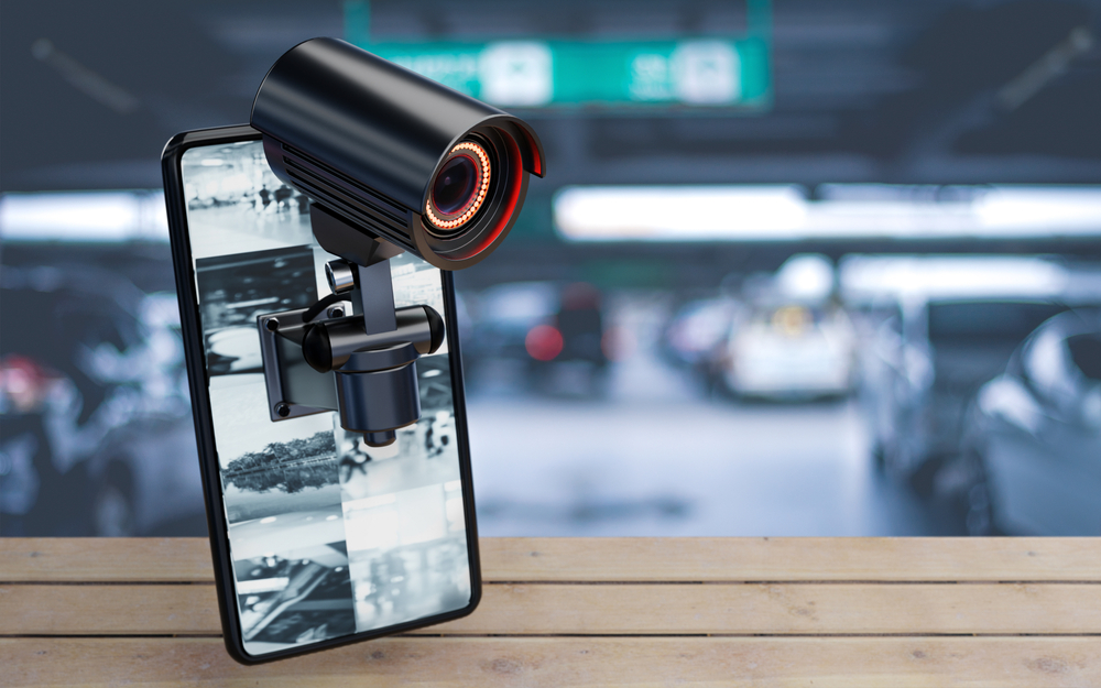 Cctv,Security,Camera,On,Smartphone,In,Parking,Lot,At,Home