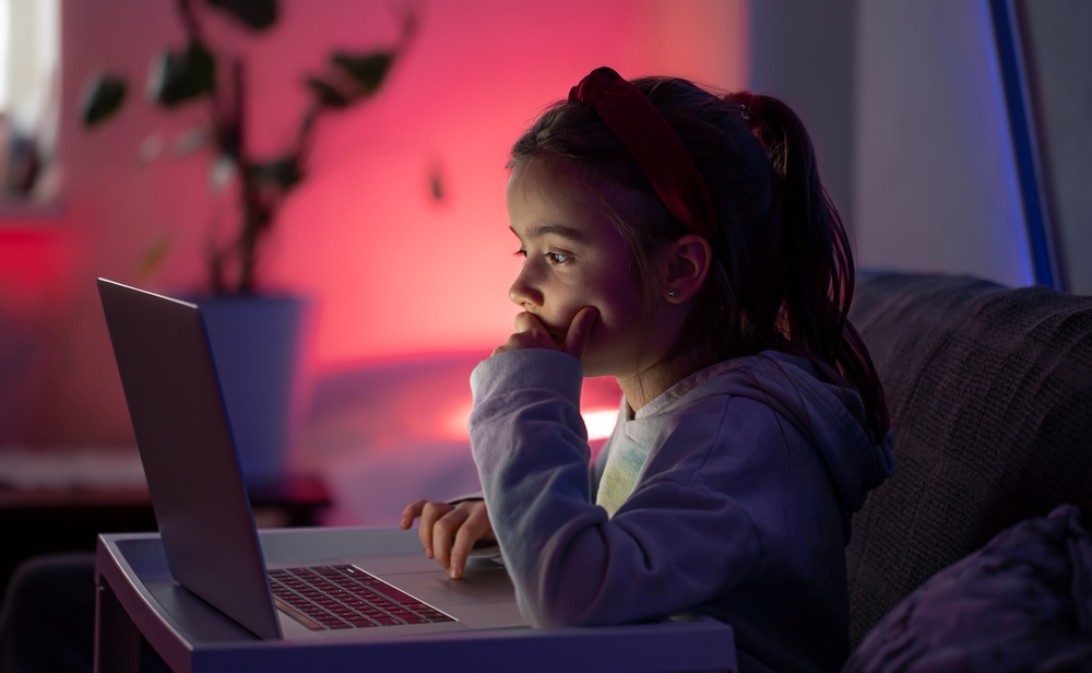 A,Little,Girl,Uses,A,Laptop,Late,At,Night,,A