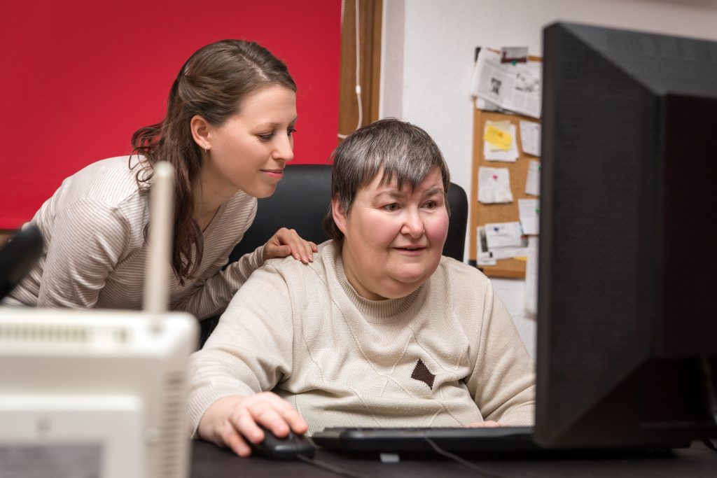 Caregiver,And,Mentally,Disabled,Woman,Learning,At,The,Computer,,Special
