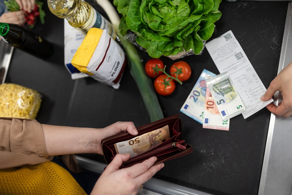 Close-up,Of,Woman,Giving,Money,At,The,Cash,Desk,In