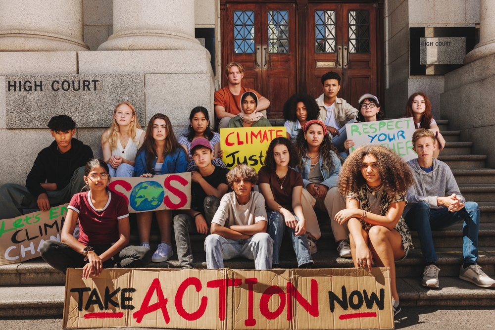 Group,Of,Climate,Change,Activists,Looking,At,The,Camera,While