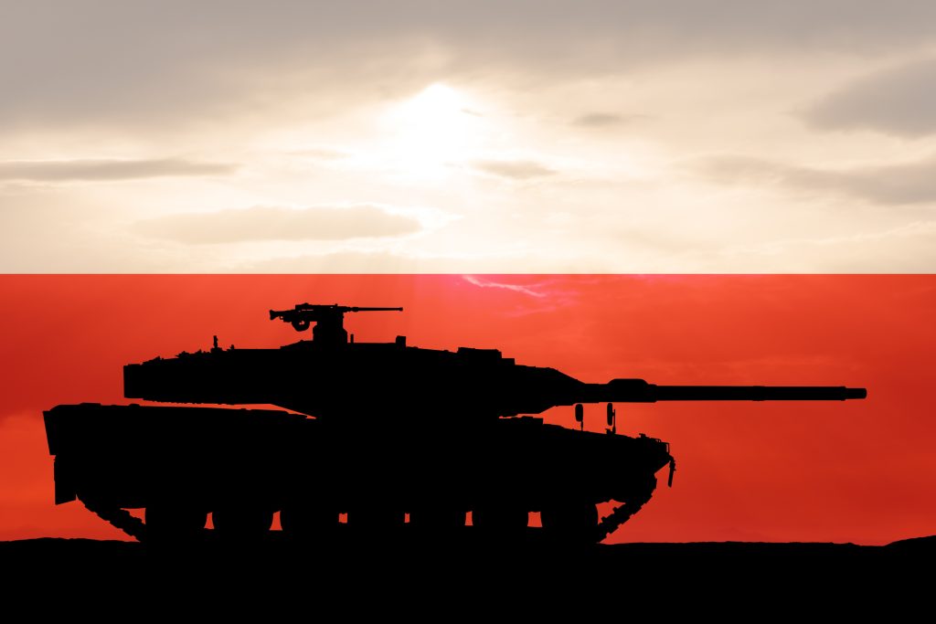 German main battle tank on the background of the Polish flag