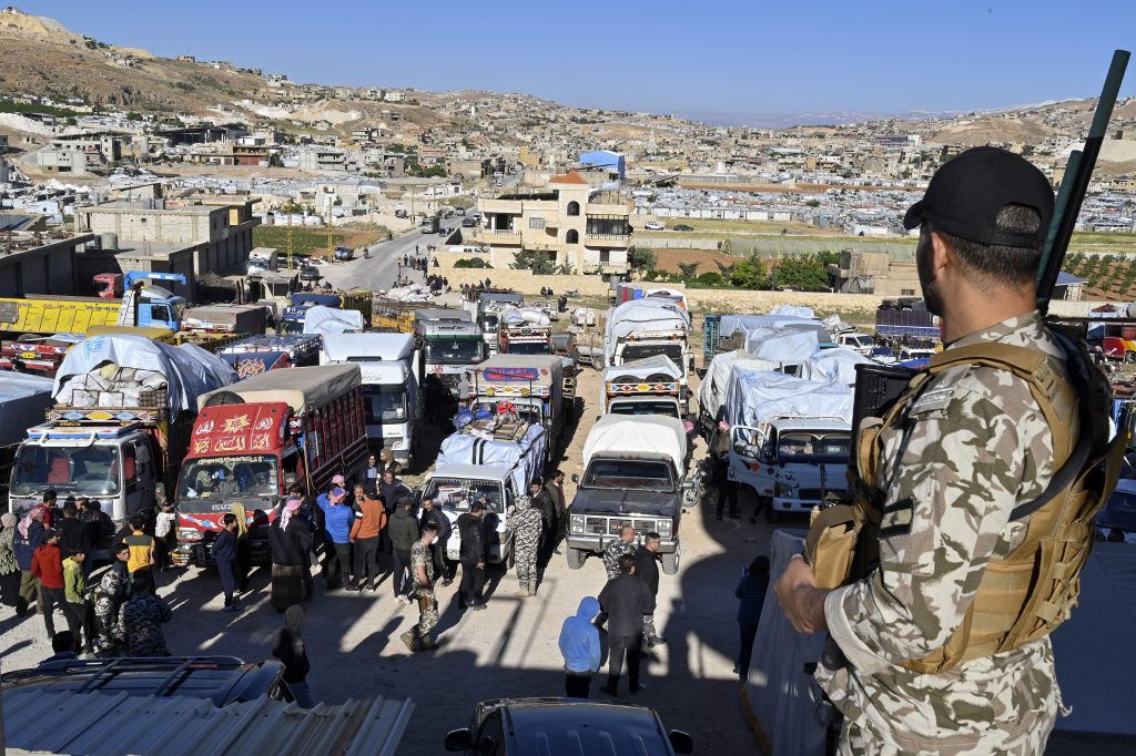 Syrian refugees leave the village of Arsal in Lebanon for Syria