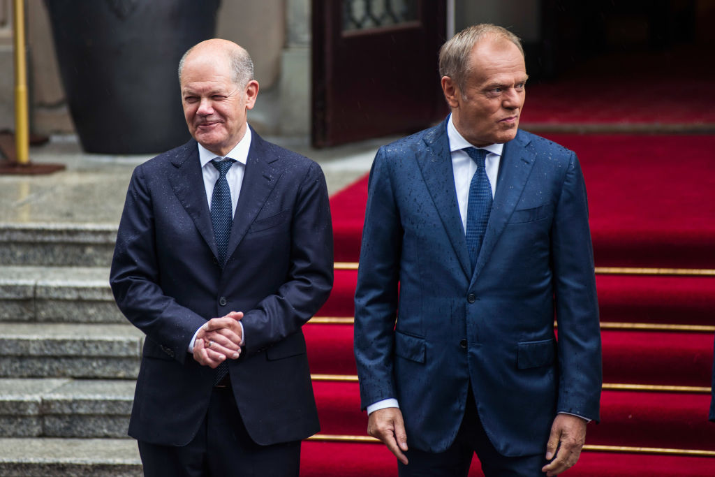 Prime Minister Donald Tusk (R) welcomes the German
