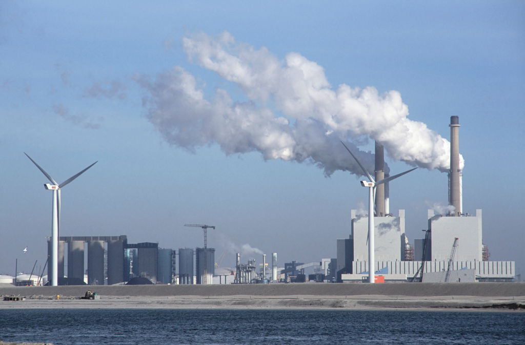 Windmill alongside coal fired power station in the Maasvlakte outer Rotterdam docks, Netherlands
